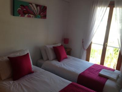 Bed 2 - view over pool and french doors to balcony